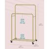 imageSONGMICS Clothes Rack with Wheels Clothing Rack for Hanging Clothes 254 mm Metal Garment Rack with Dense Mesh Storage Shelf 110 lb Load Capacity 2 Brakes Black UHSR25BKGold