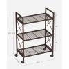 imageSONGMICS 3Tier Metal Storage Rack with Wheels Mesh Shelving Unit with X Side Frames 236Inch Width for Entryway Kitchen Living Room Bathroom Industrial Style Black UBSC163B01Metallic Bronze