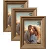 imageSONGMICS 5x7 Picture Frames with 6 Mats for Wall Set of 3 Collage Photo Frames for 5x7 4x6 35x5 Pictures Hanging or Table Display Glass Front 5 NonTrace Nails Teak Brown URPF045K01Teak Brown